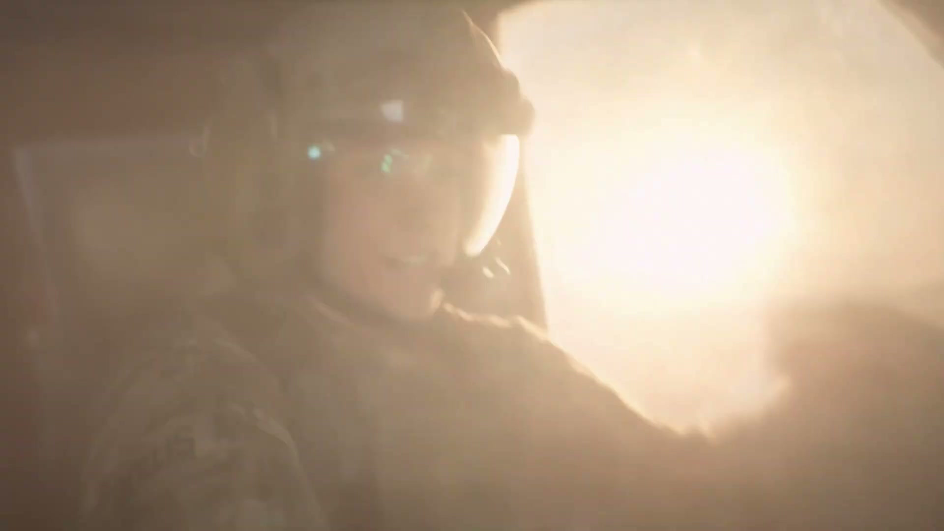 Hollis lit by the blast, a beat before impact.