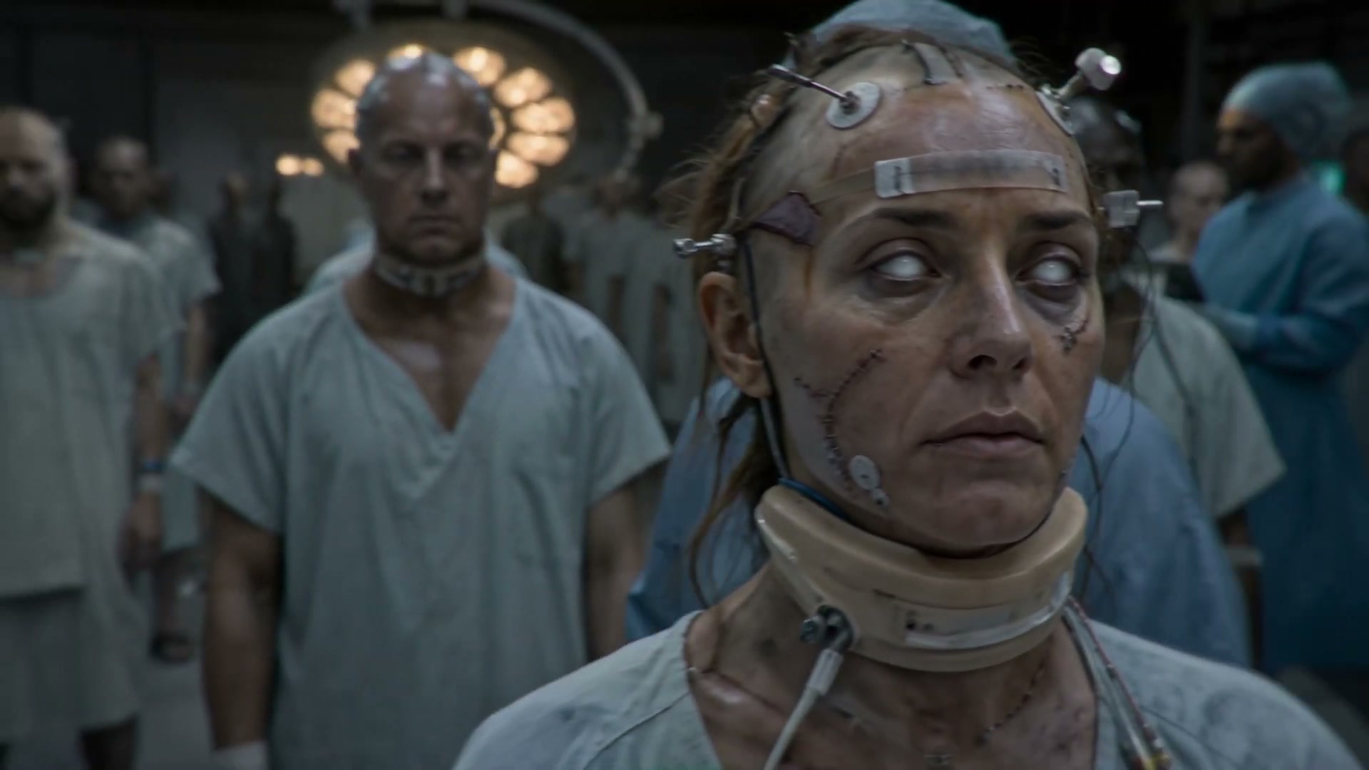 The revived pilot, Hollis, in the film's third act — Blomkamp's body-horror signature, generated.