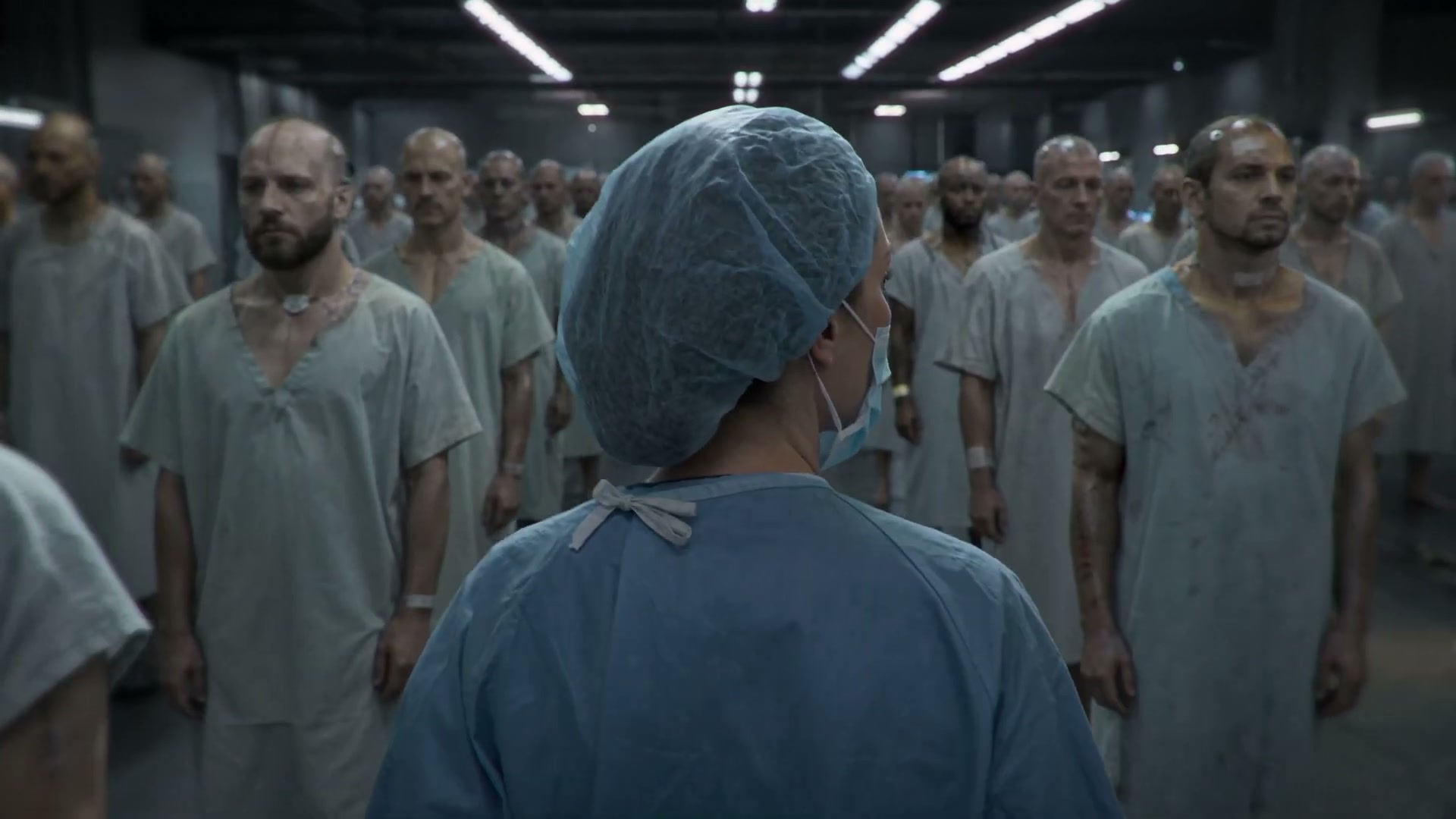 Revived soldiers stand in ranks inside the classified program's facility — the film's defining image.