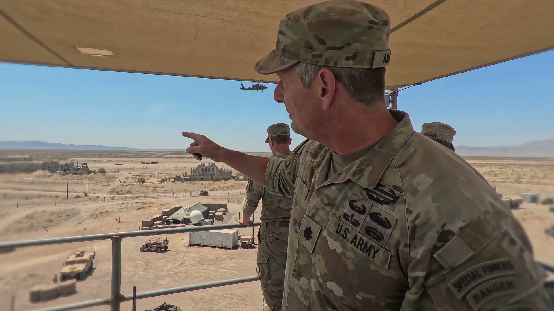 A commander walks press through the demonstration range — mockumentary framing throughout.